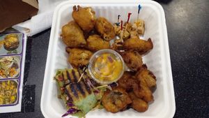 Personal vegan platter: mushroom veggie wrap with vegan cheese, popcorn mushroom, cauliflower bites, tofu and mango salsa. $35EC at Akasha Metaphysical & Vegan Cafe in St Georges