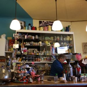 Ria the owner behind the counter at Cafe Voltaire in Den Bosch