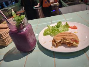 Blueberry smoothie, chickpea chorizo panini w vegan cheese at The Good Food Co. in Phnom Penh