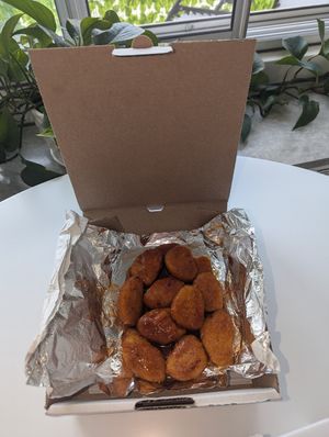 Plant based chick'n with hot honey sauce at Pizza Nova - Church St in Toronto