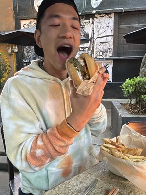 Burger was delicious! You can see the cool art in the background too. Funky place   at Los Loosers in Mexico City