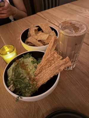 Guac and chips with horchata mocktail  at Sentir in New York City