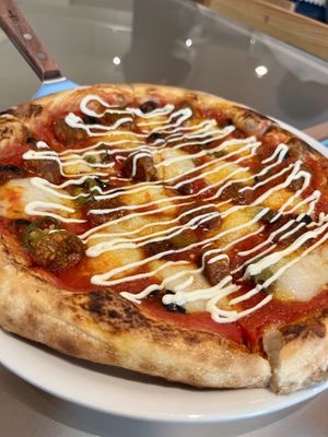 Spicy sausage pizza with home made vegan mozzarella cheese on top. I wish it has less sauce tomato sauce and no mayo on top.   at Weirdough - 위어도우 in Seoul