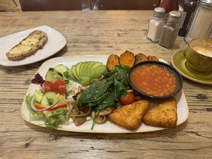 Vegan breakfast with toast and oat milk latte.  at Pedro's Café  in North West London