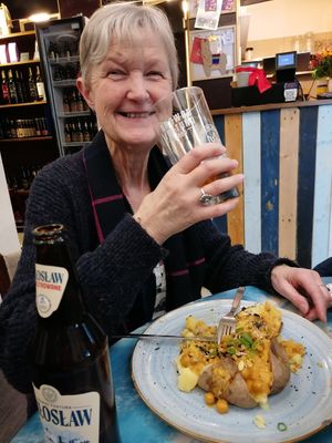 Baked potato covered in curry at Pyraland in Poznan