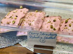 Cherry Strawberry Pistachio Ghost tarts in the case  at DOUGH  in Dayton