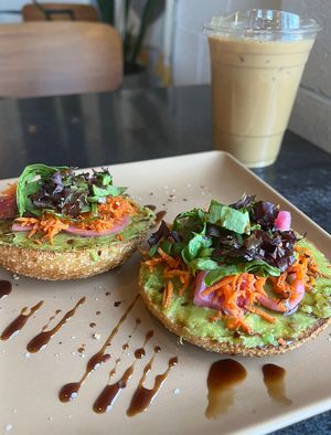 Avocado Bagel Toast special and oat milk lattee  at DOUGH  in Dayton