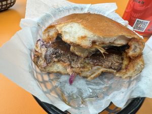 Vegan. Plant based patty, flat mushroom, vegan cheddar, smoky BBQ sauce, fried onions with vegan slaw.  at Burger Boi in Gloucester