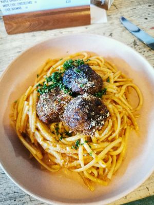 Delicious linguine pasta with a rich sundried tomato ragu topped with fennel & chilli spiked lentil balls & fresh parsley at The Kitchen @ Brixton Yoga in Leamington Spa