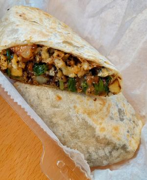 Huge breakfast burrito with egg, potatoes, and sausage, all vegan of course at Clean Plates Café & Juice bar  in Reading