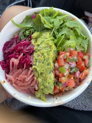 Burrito bowl with rice + beans + tempeh + arugula + pickled onions + purple cabbage + guaca + pico   at Poppo's Taqueria in Anna Maria