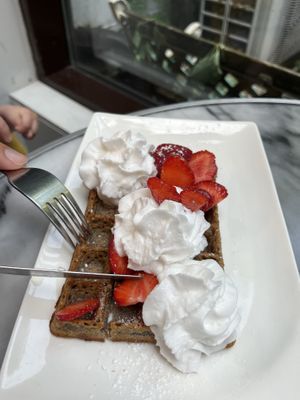 Vegan waffle with vegan chantilly cream and strawberriess  at La Maison Oflore in Montreal