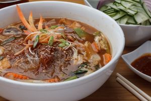 Vegan Sukiyaki Noodles - Glass noodle stew with Chinese broccoli, Napa cabbage, celery, carrot, onion, button mushroom, and scallion, with sauce of chili  paste, pickled garlic, and sesame oil. at SukhoThai - Uptown  in New Orleans
