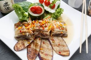 Vegan Char-grilled Eggplant - Spicy warm salad of roasted Chinese eggplant in a lime-chili garlic sauce, tossed with red & green onion, cilantro, and mixed greens. at SukhoThai - Uptown  in New Orleans