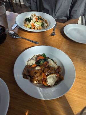 Vegan dirty noodles lunch portion (front) and vegan peppery garlic with tofu dinner portion (back) at SukhoThai - Uptown  in New Orleans