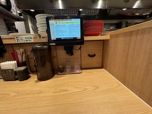 Single seat with tablet for ordering .  at Ramen Kiou - JR Shin-Osaka Station in Osaka