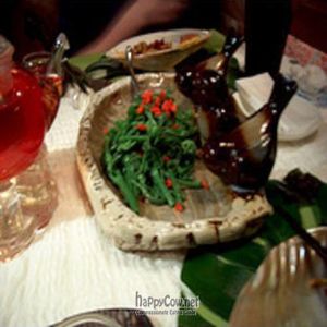 Bergamot greens w/ wolfberries in a ceramic bird dish. at Pure Lotus - Jìng Xīn Lián 净心莲 in Beijing