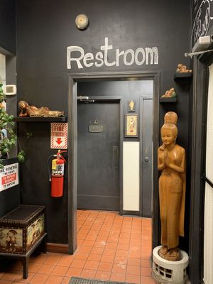 Restroom statues at Siam Cuisine in Anchorage