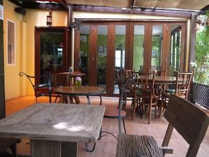 Outside seating in garden area. at Suananda Vegetarian Garden in Bangkok