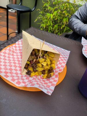 Papás bomba con toppings de seitán y chorizo at Antiburguesas in Bogota