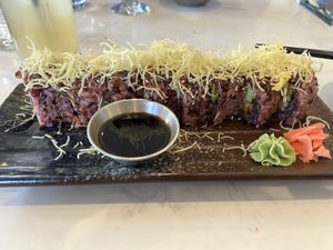 Crispy Chickn roll - purple rice; avocado; something on top. Filling; tasty; not life-altering    at Origami - Napier in Napier