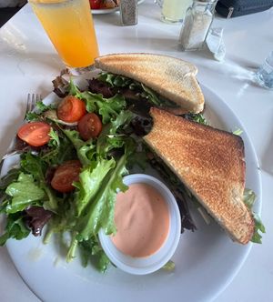 Vegan “steak” sandwich with side salad and passion fruit juice   at St Germain Bistro and Cafe in San Juan