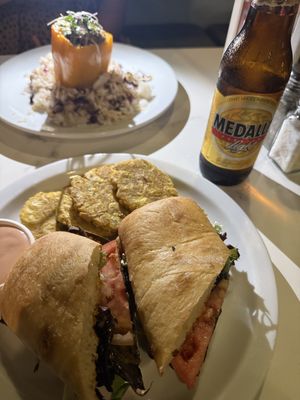 Vegan steak sandwich and vegan stuffed pepper with vegan cheese and stuffed with lentils   at St Germain Bistro and Cafe in San Juan