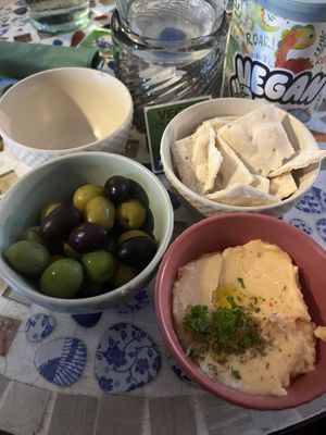 From the mezze & starters menu: olives and spicy Feta dip   at The Crazy Little Greek in Berlin