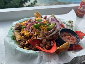 Classic nachos with vegan cheese and crumble. Jalapeños and onions were and extra $.50 each     at Louie & Nacho's Beach Bar in St Croix