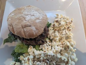 Burger and POPCORN!! 🧡🧡🧡 at Unrefined Wellness Bar in Eugene