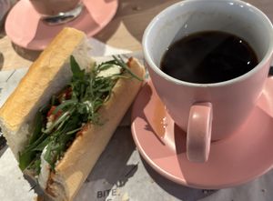 Veggie sandwich with an Americano. So good, I ate and drank half of my lunch before taking this photo!  at Tasty Bruges in Bruges