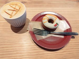 Black honey latte and a vegan carrot donut at Good Coffee Farms Cafe & Bar in Tokyo