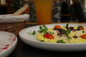 *vegan tofu scrambled "eggs", comes with small basket of bread and flora vegan butter at Al Ponte Prague in Prague