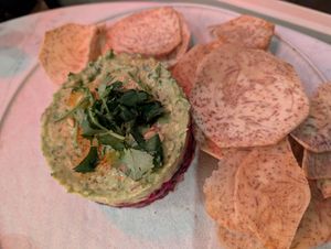AVOCADO LIME TARTARE
beetroot tuna, pine nuts, capers, citrus soy, sesame, cilantro, taro chips, contains nuts - gluten free
 at PLANTA Cocina in Washington
