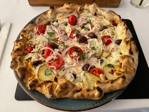 Vegan ftira with stringy vegan mozzarellaa  at Piatto Nero Ristorante in Mellieha