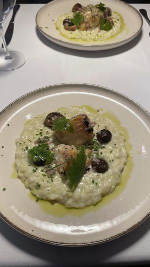 Citrusy lovage risotto with pickled shiitake mushrooms and roasted celery.  at Ravintola Pikku Hukka in Helsinki