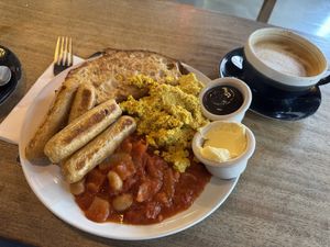 Sausages, tofu scramble, homemade baked beans and toastt  at Hustle in Belfast