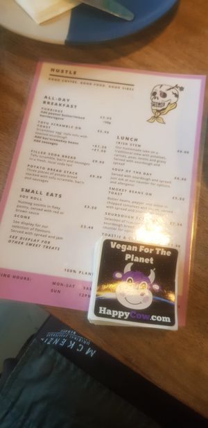 Menu and happycow seal of approval at Hustle in Belfast