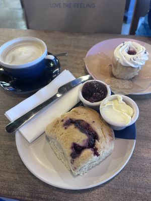 Raspberry and dark chocolate scone. Victoria sponge cupcake. Pistachio latte!  at Hustle in Belfast