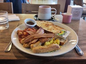 Back for breakfast. Scrambled tofu on toast with all the extra trimmings. It rocked, as did the early New Order background music. at Hustle in Belfast