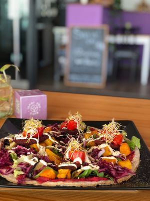 Flatbread with beetroot hummus and roasted veggies at inner you vegan in Tenerife