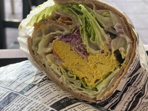 WRAP FILLED WITH VEGAN PUMPKIN SEED EGG, LETTUCE, RED CABBAGE, ONIONS, TOMATOES, CASHEW GARLIC SAUCE    at inner you vegan in Tenerife