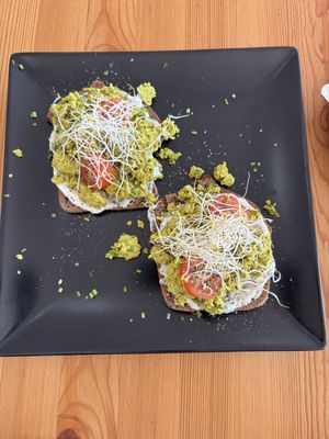 Homemade pumpkin seed egg with chive cheesy sauce on rye bread   at inner you vegan in Tenerife