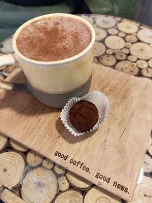 Cocoa with coconut milk and raw vegan candy at ALTAR in Yerevan