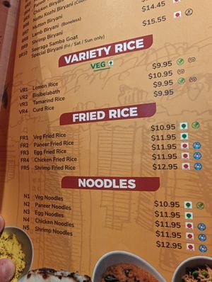 Vegan dishes marked with green leaf at Sangam Chettinad Indian Cuisine in Austin