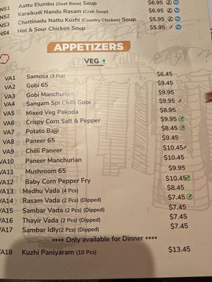 Vegan dishes marked with green leaf at Sangam Chettinad Indian Cuisine in Austin