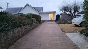 The apartment is straight ahead at the end of a private, gated drive. There's space for 2 cars in the car parking area on the right if you prefer and we have an EV charger too. at The Wildflower Retreat Vegan B&B in Tipton St John