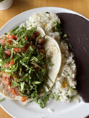 Pura vida (plantains) with rice and beans  at Taco Ocho in Richardson
