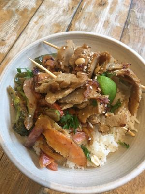 Seitan skewers and satay sauce with veg and rice.  at The Good Apple Cafe in Sunderland