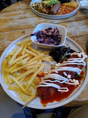Korean corndog with chips and coleslaw at The Good Apple Cafe in Sunderland